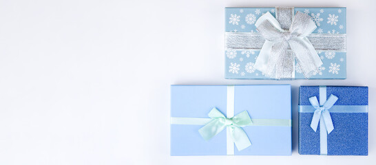 Blue boxes with Christmas gifts  on a white background. Christmas sale,holiday discounts,New Year background