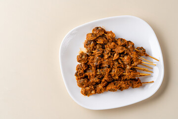 Sate Kerang Or Satay Kerang is a Traditional Indonesian Food made from Shell and covered with sauce. Sate Kerang Angkringan.  Selective focus. macro food.