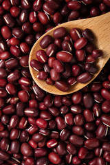 Raw adzuki red bean as background with spoon.