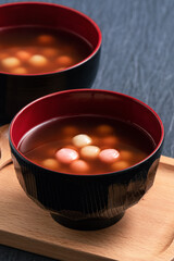Red and white tangyuan with syrup soup.