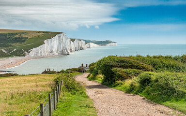 Seven Sisters, East Sussex, England. The rugged Sussex coastline looking over Cuckmere Haven and the white chalk cliffs into the English Channel. - 465536079