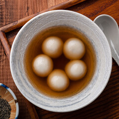 Sesame big tangyuan with syrup soup.