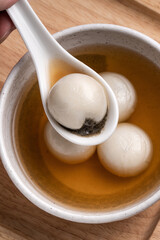 Sesame big tangyuan with syrup soup.