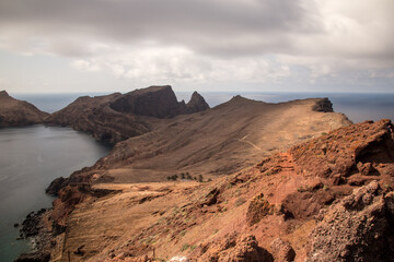 Ilhéu da Cevada, Madeira, view over rocks and sea with cloudy sky