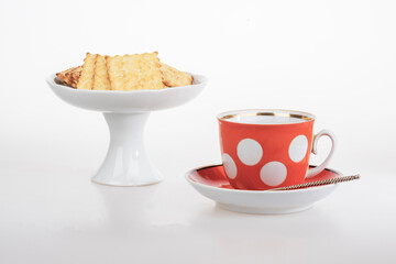 Red cup of coffee French crackers
