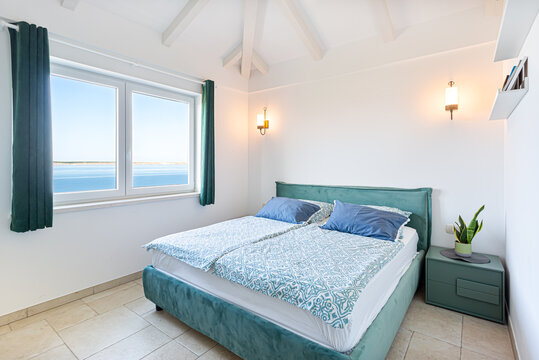 Cozy bedroom with seaside view
