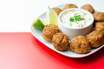 Falafels, gently spiced blend of sweet potato, chickpeas and onion with a sour dip