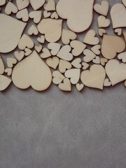 Obraz premium valentine's day greeting card-wooden hearts on a gray suede background. High quality photo