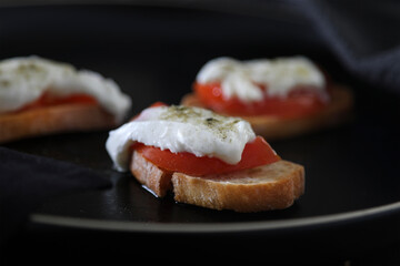 Toast with mozzarella cheese and fresh tomatoes