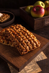 Sweet apple pie on wood