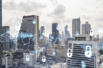 Padlock icon hologram over panorama city view of Bangkok to protect business in Southeast Asia. The concept of information security shields. Double exposure.