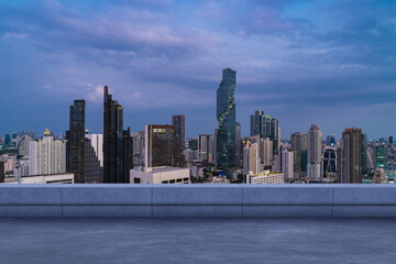 Fototapeta na wymiar Panoramic Bangkok skyline view, concrete observatory deck on rooftop, sunset. Luxury Asian corporate and residential lifestyle. Financial city downtown, real estate. Product display mockup empty roof