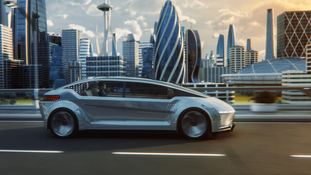 Futuristic Concept: Stylish Japanese Businessman Riding on a Back Seat of an Autonomous Self-Driving Zero-Emissions Electric Car. He is Riding on the Highway in the City of the Future.