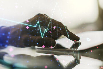 Creative abstract heart rate sketch and hand working with a digital tablet on background, Medicine and healthcare concept. Multiexposure