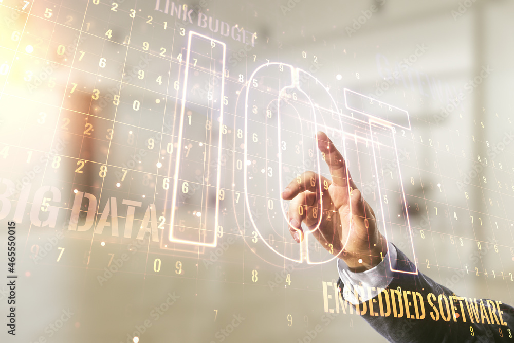 Poster man hand working with abstract virtual iot hologram on blurred office background, internet of things