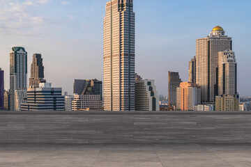 Fototapeta na wymiar Panoramic Bangkok skyline view, concrete observatory deck on rooftop, sunset. Luxury Asian corporate and residential lifestyle. Financial city downtown, real estate. Product display mockup empty roof