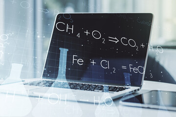 Creative chemistry concept on modern laptop background. Multiexposure