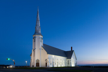 Blue hour sunset view of historic 1881 St. Pierre-de-la-Verniere Church in Cap-aux-Meules, Magdalen...