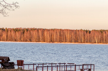 Russia. Spring. Morning. Sanatorium Lunevo. View of the forest on the banks of the Volga in the sunlight.