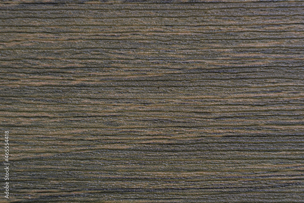 Poster the abstract horizontal surface of the slick plywood in brown for a background pattern. a detailed e