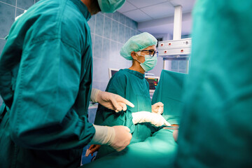 Group of surgeon at work in operating room in hospital