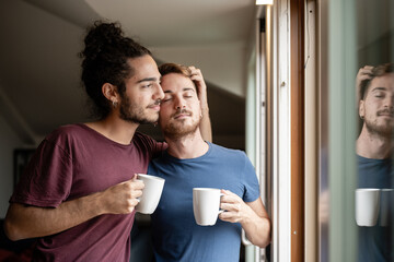 Gay couple sharing a special moment in the morning, homosexual romantic tenderness, men drinking coffee at breakfast, gay couple love home concept