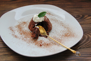 chocolate dessert lava cake fondant on a plate with cream