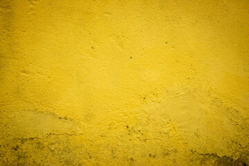 fond ou texture abstraite de mur de béton jaune