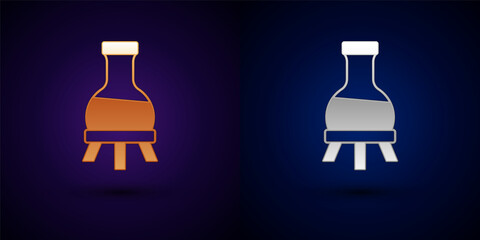 Gold and silver Test tube and flask chemical laboratory test icon isolated on black background. Laboratory glassware sign. Vector