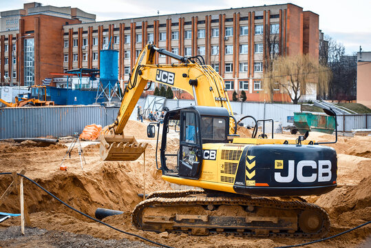 Minsk, Belarus. Apr 2020. JCB Tracked excavator JS205lc at construction site. JCB industrial earthmover, excavation work. Earth moving heavy duty vehicle. Earthwork with heavy machinery