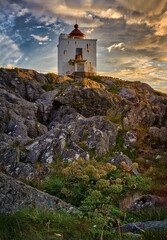 Fototapeta na wymiar Ulla lighthouse on a warm summers day, Haramsøya, Ålesund, Norway