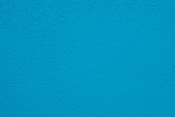 Fototapeta na wymiar Seamless texture of blue cement wall a rough surface, with space for text, for a background..