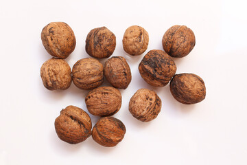  whole walnuts, isolated on white background