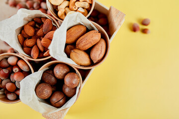 Assorted nuts in box nuts: pecan, almond, macadamia, brazil, cashew, hazelnut, Rich in minerals and protein. Healthy nutrition, high in zinc, magnesium and vitamins, online ordering, shoping concept.