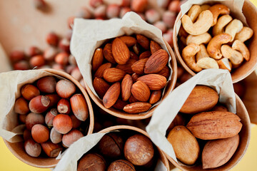 Assorted nuts in box nuts: pecan, almond, macadamia, brazil, cashew, hazelnut, Rich in minerals and protein. Healthy nutrition, high in zinc, magnesium and vitamins, online ordering, shoping concept.