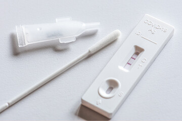 Positive Covid-19 antigen test kit, one step coronavirus antigen rapid test, saliva swab, on a...