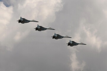 A group of SU-35S multi-purpose fighters in the sky over Moscow's Red Square during the dress rehearsal of the Victory Day air parade