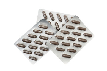 Three blister bubble packs with medicin in brown capsules on top of each other seen directly from above and isolated on white background