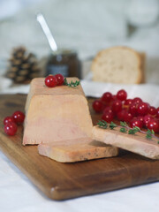 A traditional French foie gras to celebrate a new year's eve and festive, decorated with redcurrant and thyme leaves. It's a famous French new year menu.  © Pkheawtasang
