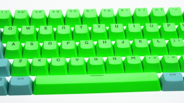 Loose computer keyboard keys panning shot
