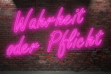 Neon erotic game Truth or Dare (in german Wahrheit oder Pflicht) lettering on Brick Wall at night