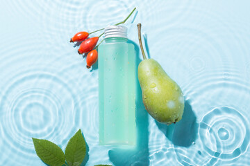 Natural cosmetic products in water on a blue background. Cosmetic jar mockup. Water stains. Drops.
