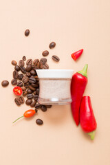 Natural cosmetic products with red chili peppers on a light beige background. Cosmetic jar mockup.