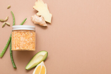 Natural cosmetic products on a dark beige background. Cosmetic jar mockup.