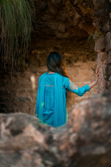 Back view of a girl in Pakistani dress standing in Rohtas Fort