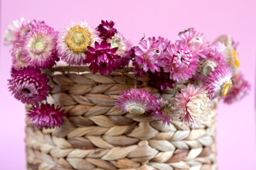 Purple flowers on water hyacinth hand made basket.