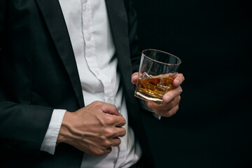 Businessmen in suits drinking whiskey