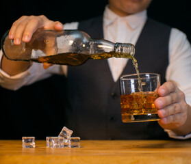 Barman pouring whiskey whiskey glass beautiful night