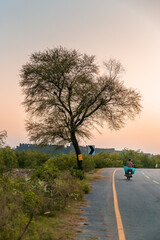 Motorcycle going on a village road in Pakistan
