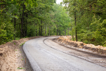 Obraz premium New asphalt road in the countryside. Road making